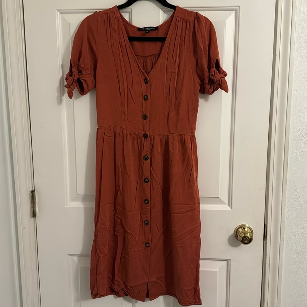 One clothing, small, burnt orange brick color, ptp 17in, length 36in